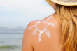 stock-photo-12729670-woman-with-suntan-lotion-on-her-skin-at-the-beach.jpg